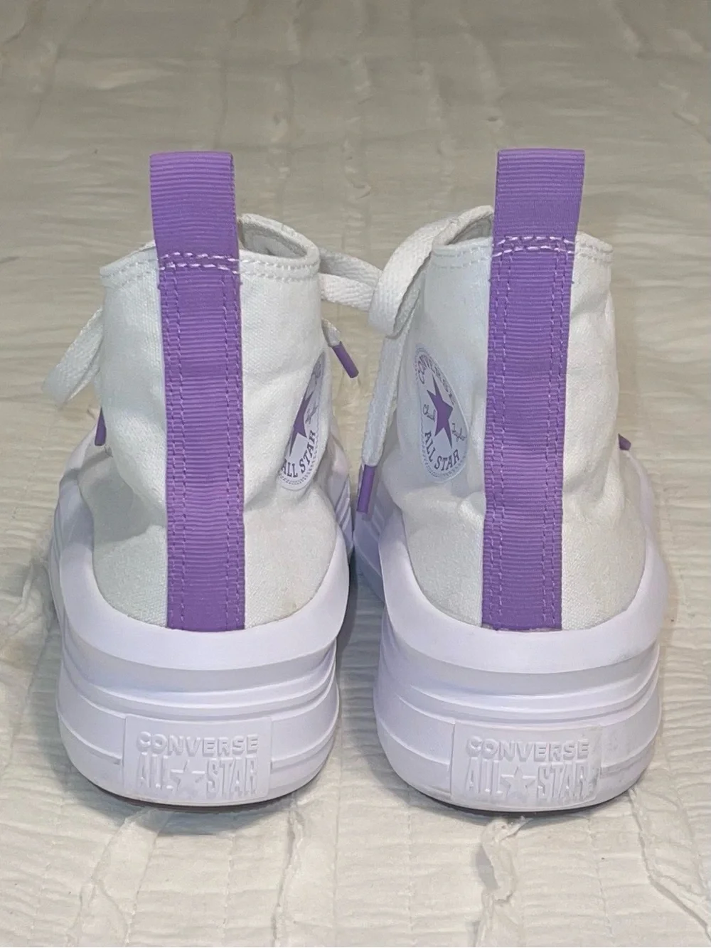 Converse High Top Sneakers in White with Purple Star Accent